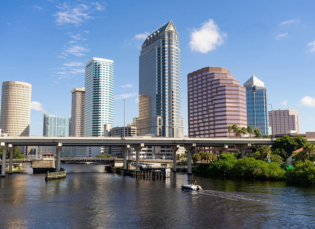 Tampa, FL - View of Modern Skyscrapers Against a Blue Sky in Downtown Tampa Florida with Views of the Waterway